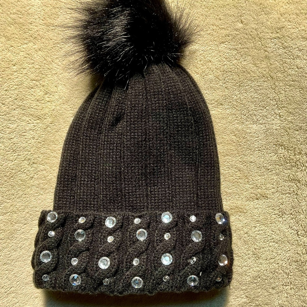 Cute embellished, black beanie hat with faux fur pompom